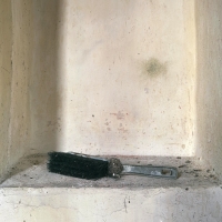 darkened plastic brush